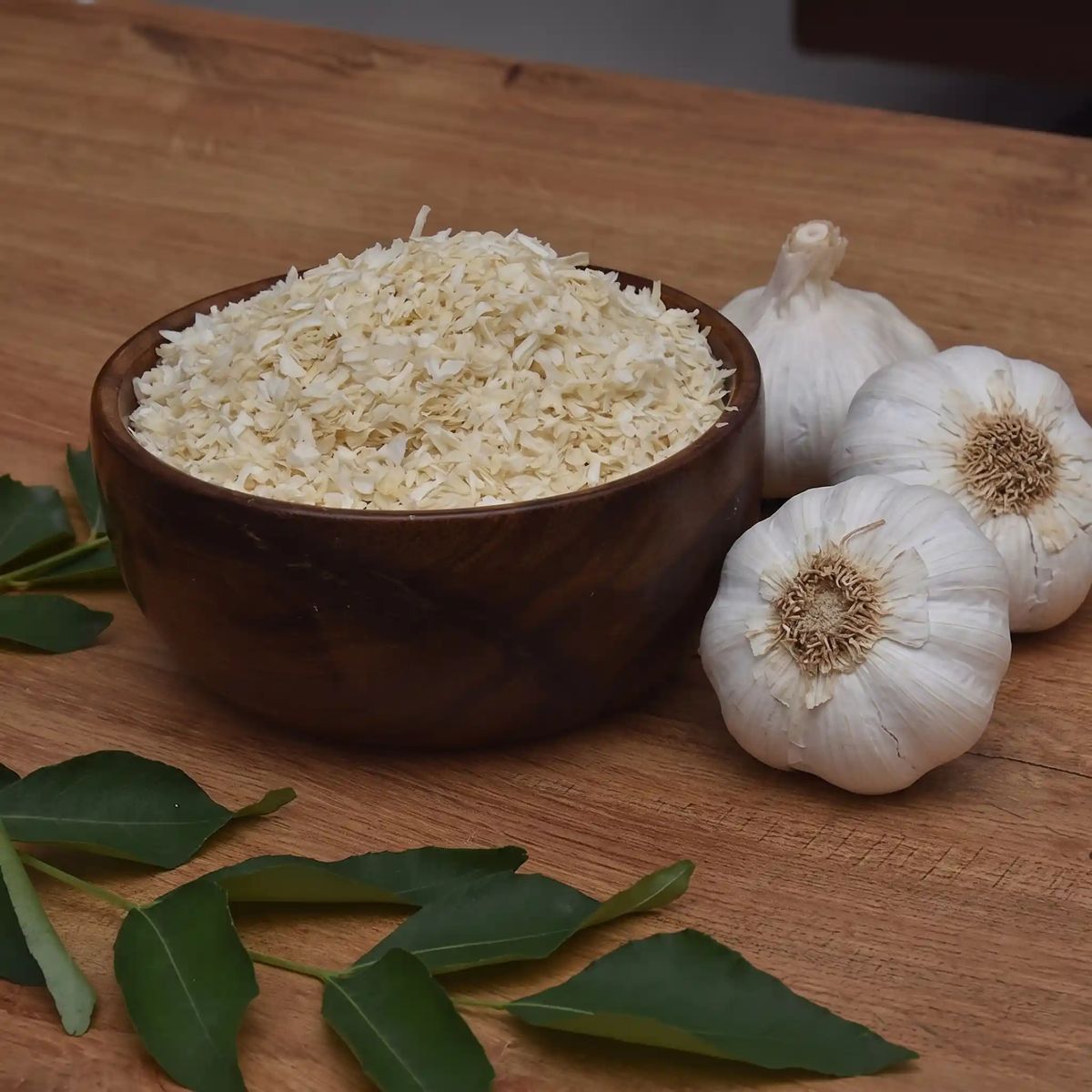 Dehydrated garlic in a wooden bowl