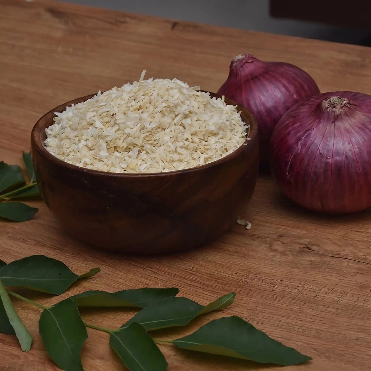 Dehydrated onion in a wooden bowl